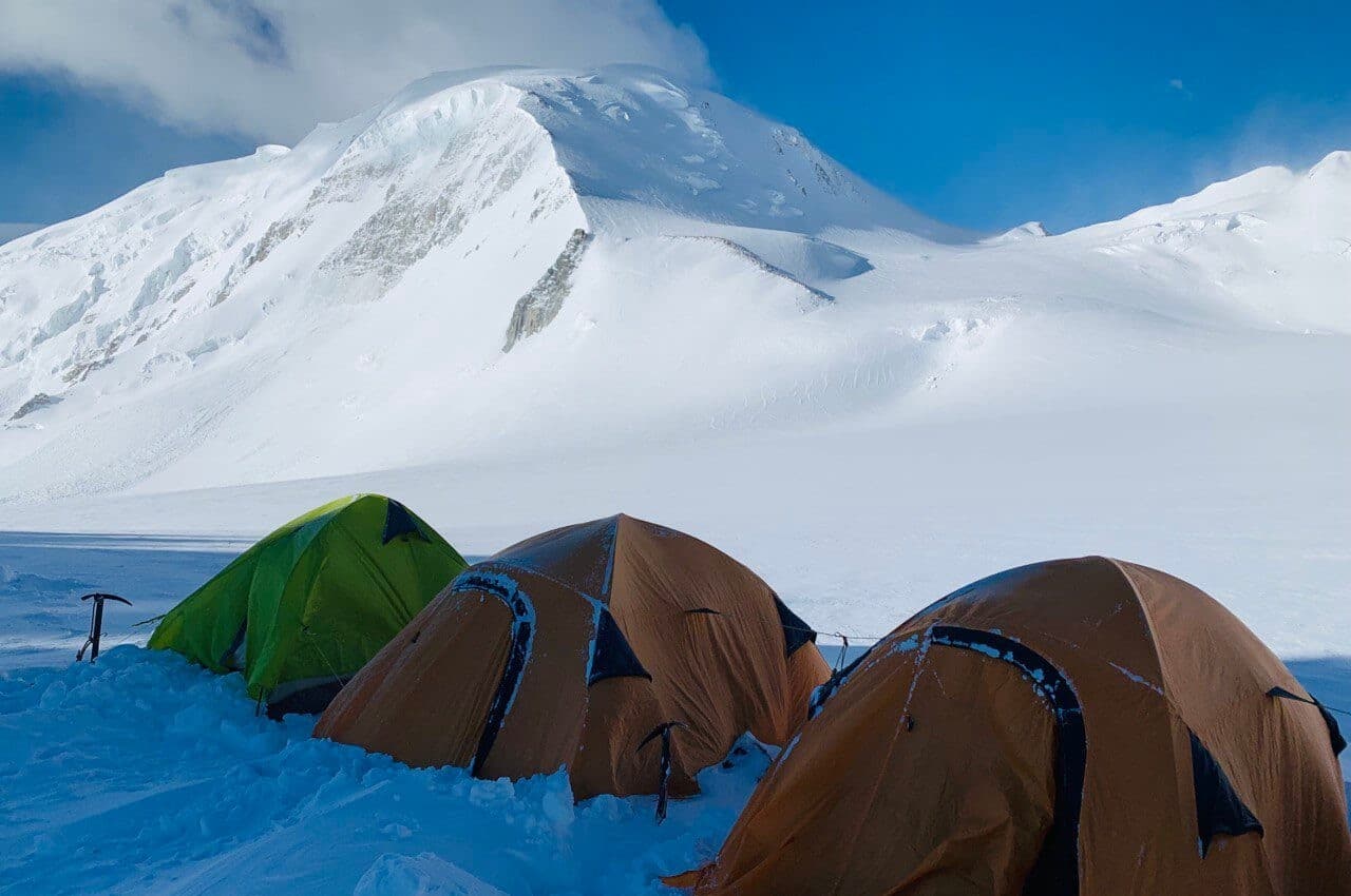 Tent at Khüiten Peak Advanced Base Camp on Potanin Glacier.