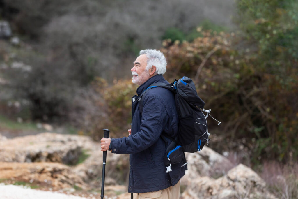 MAN WITH BACKPACK in mountain