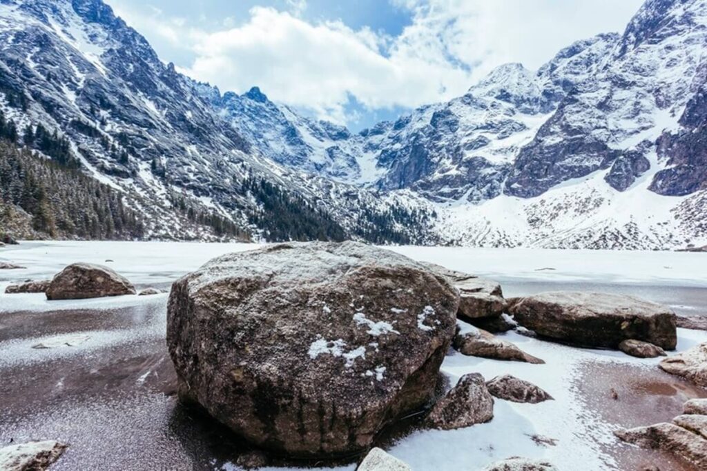 rocks lake with mountains winter 23 2148153664 1